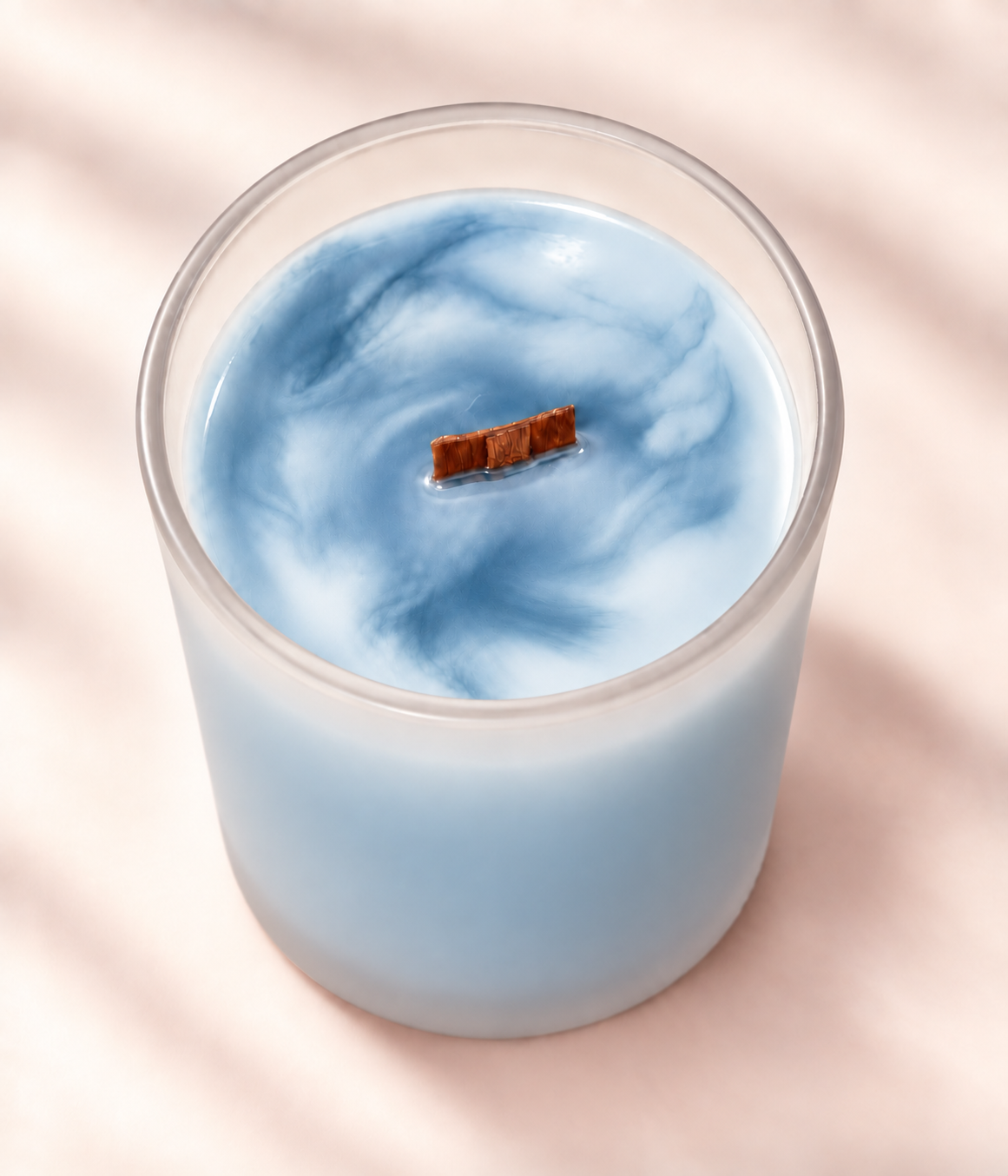 WISH Moments candle in blue marbled soy wax with a wood wick
