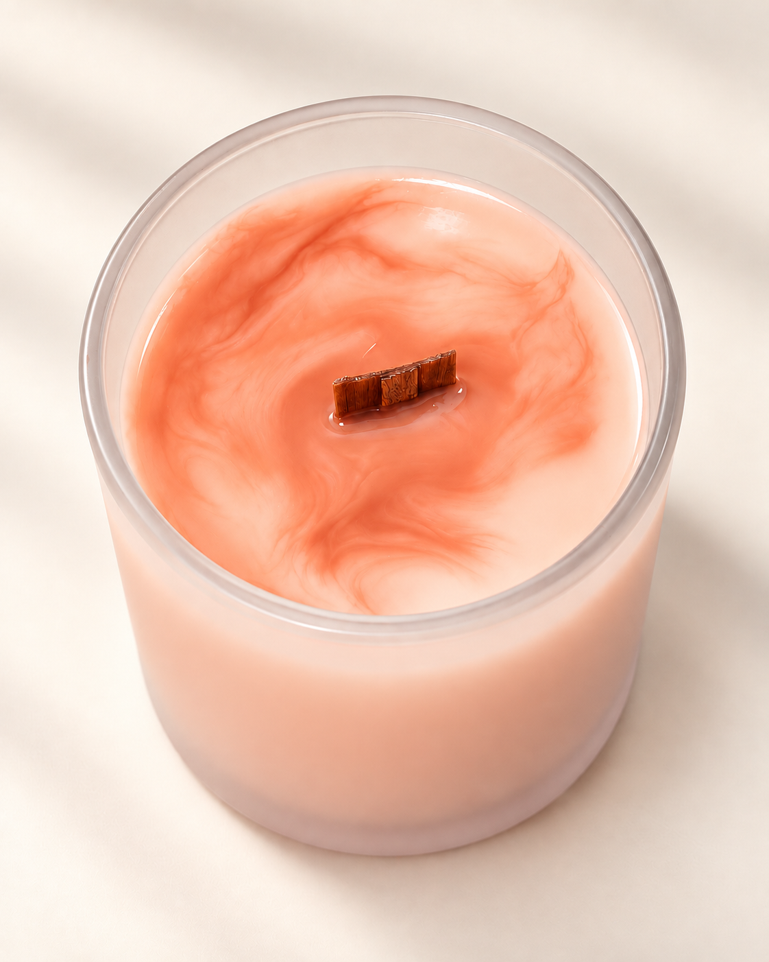 WISH Moments candle in coral marbled soy wax with a wood wick