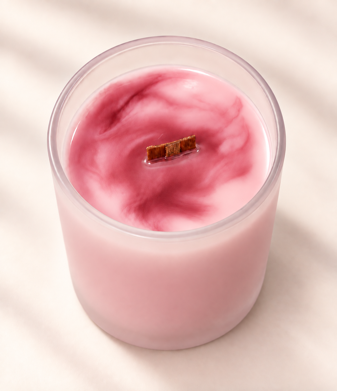 WISH Moments candle in pink marbled soy wax with a wood wick