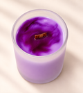 WISH Moments candle in purple marbled soy wax with a wood wick